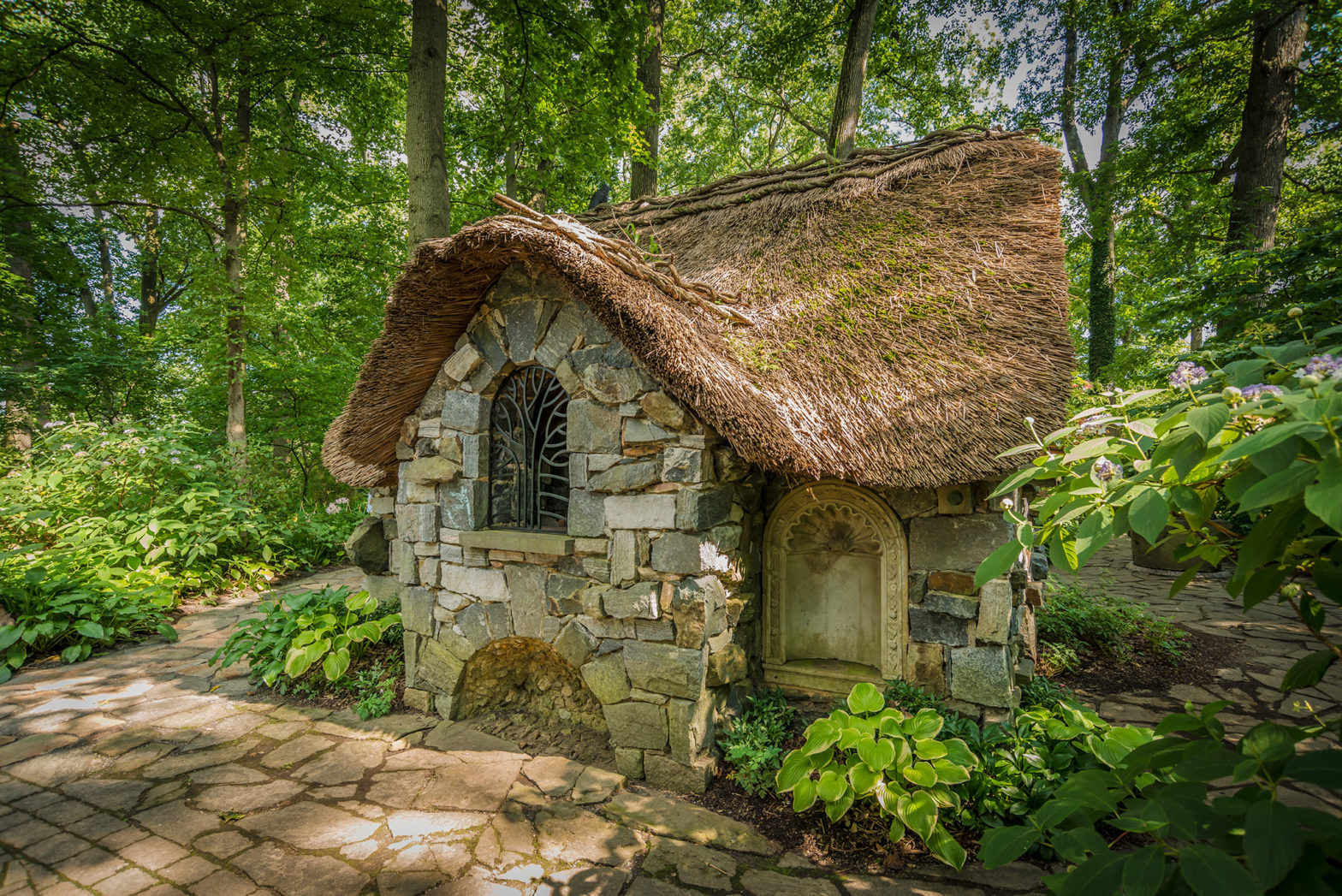 Faerie Cottage with a thatched roof in the Enchanted Woods.